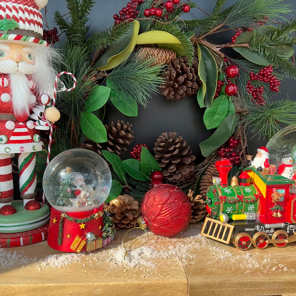 Viv! Christmas Snow Globe incl. Music Box - Santa Claus with his Playing Dog - red white green - 14 cm